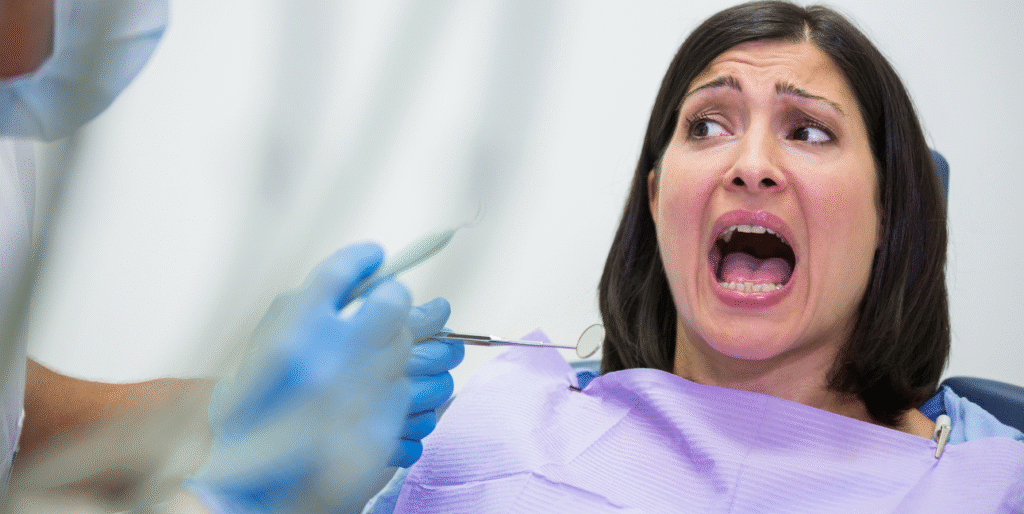Patient feeling anxious before a dental visit, experiencing dental anxiety